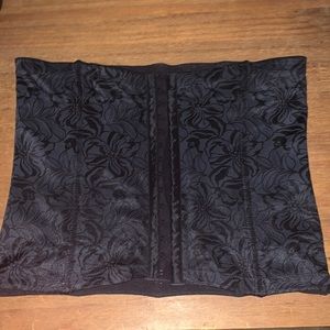 silky black , has 3 hooks so you could adjust. It has never been worn!